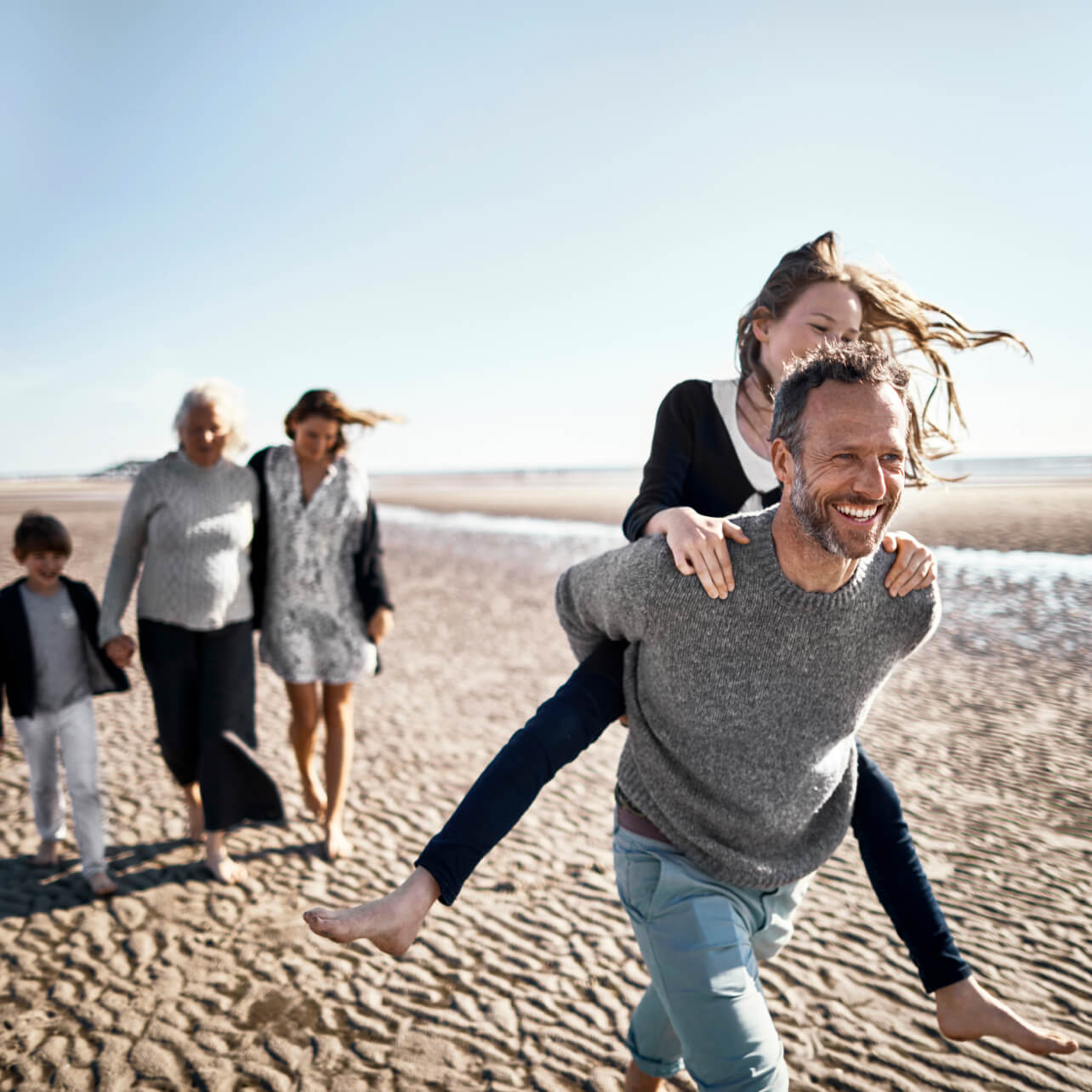 family of five on beach