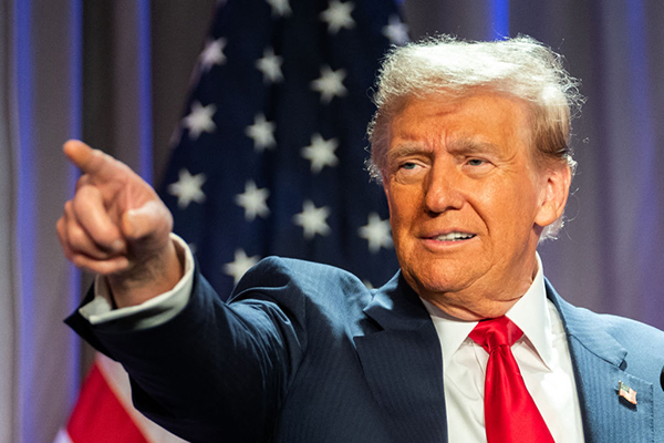 Donald Trump gestures while speaking