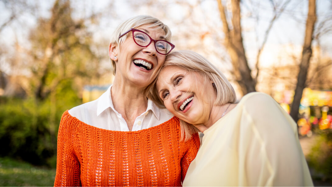 two female friends smiling and happy